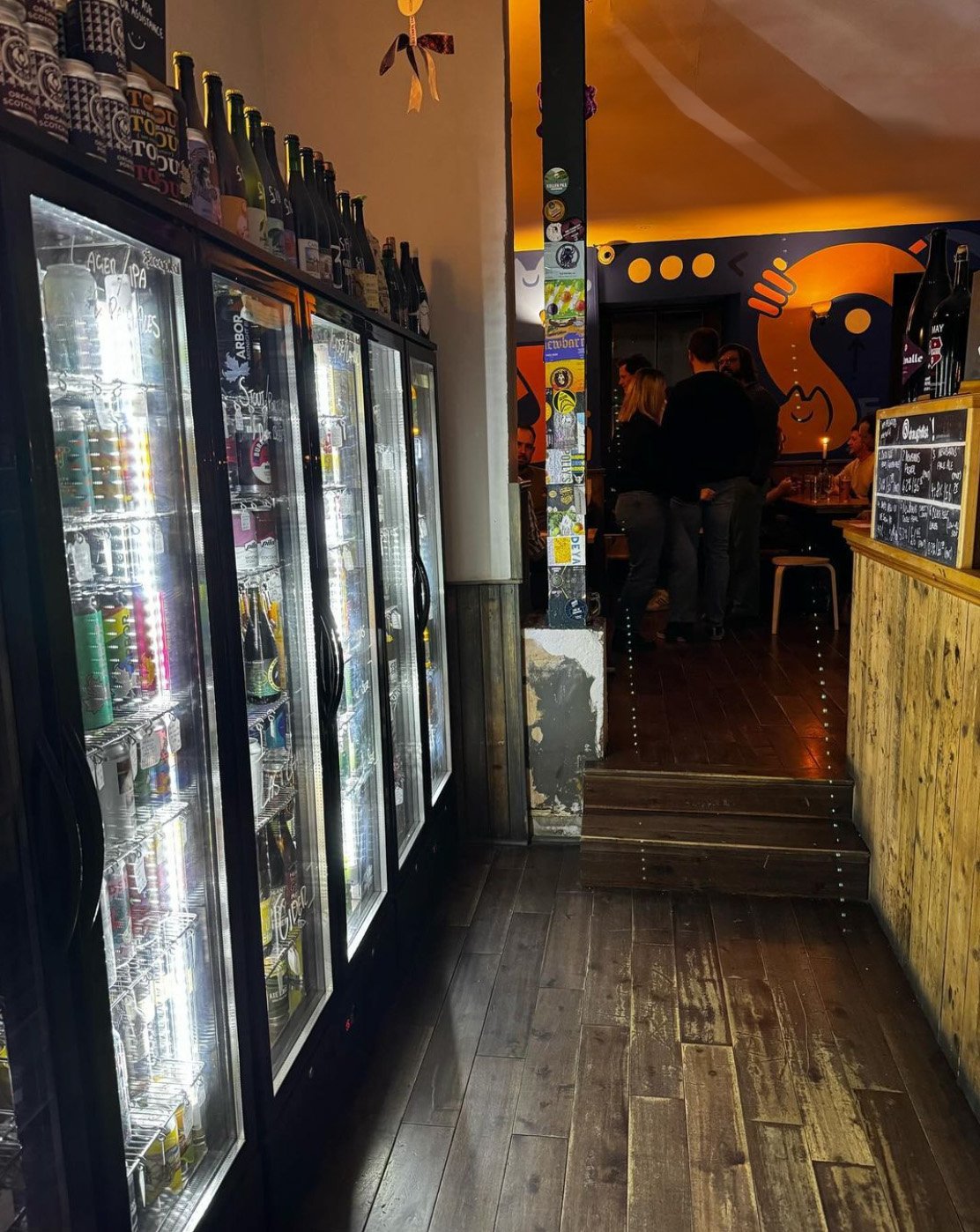 Beer fridges stocked with craft cans and bottles